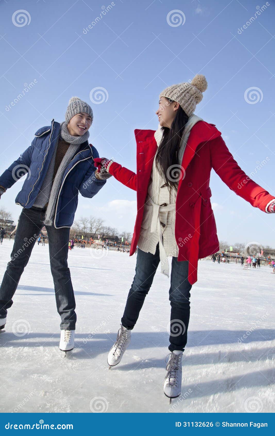 Young Couple Skating at Ice Rink, Holding Hands Stock Photo Image of