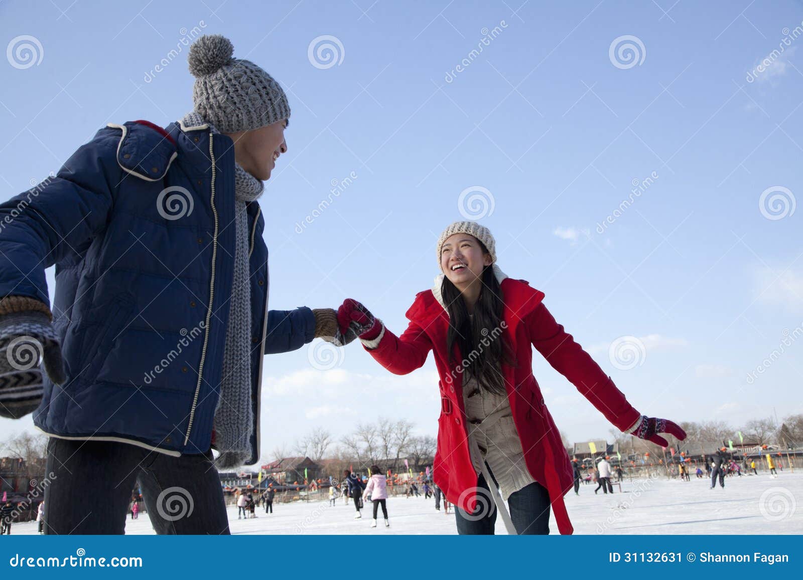 Young Couple Skating at Ice Rink, Holding Hands Stock Image Image of