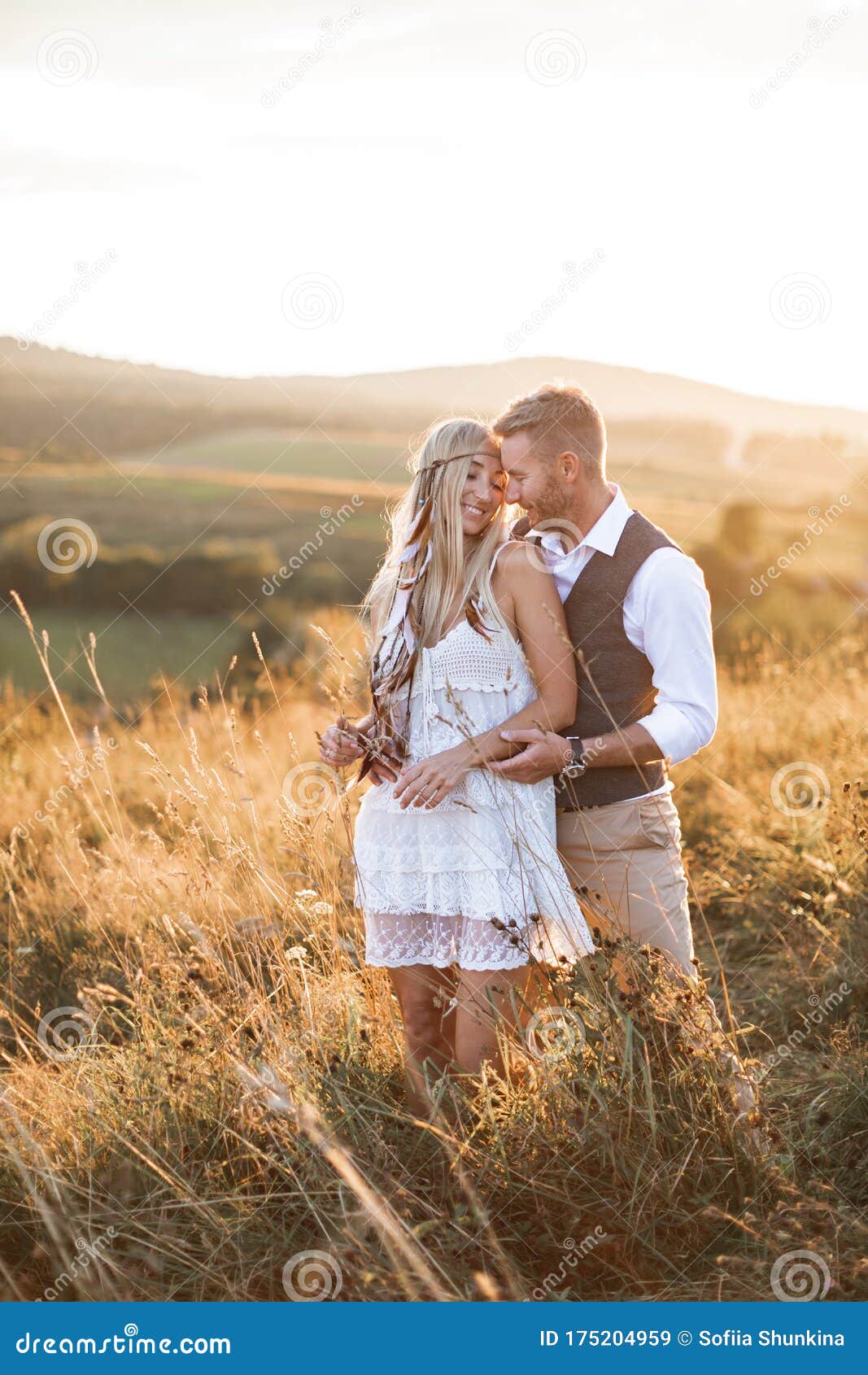 Young Couple in Stylish Boho Rustic Clothes Embracing, Standing in the