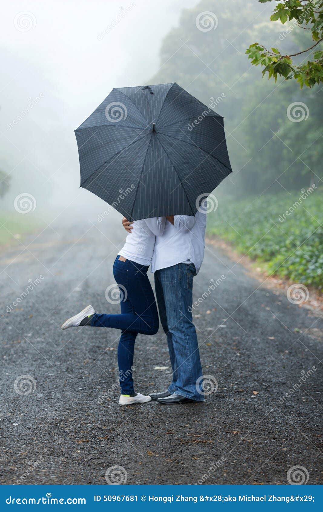 Young couple umbrella stock image. Image of husband, embracing 50967681