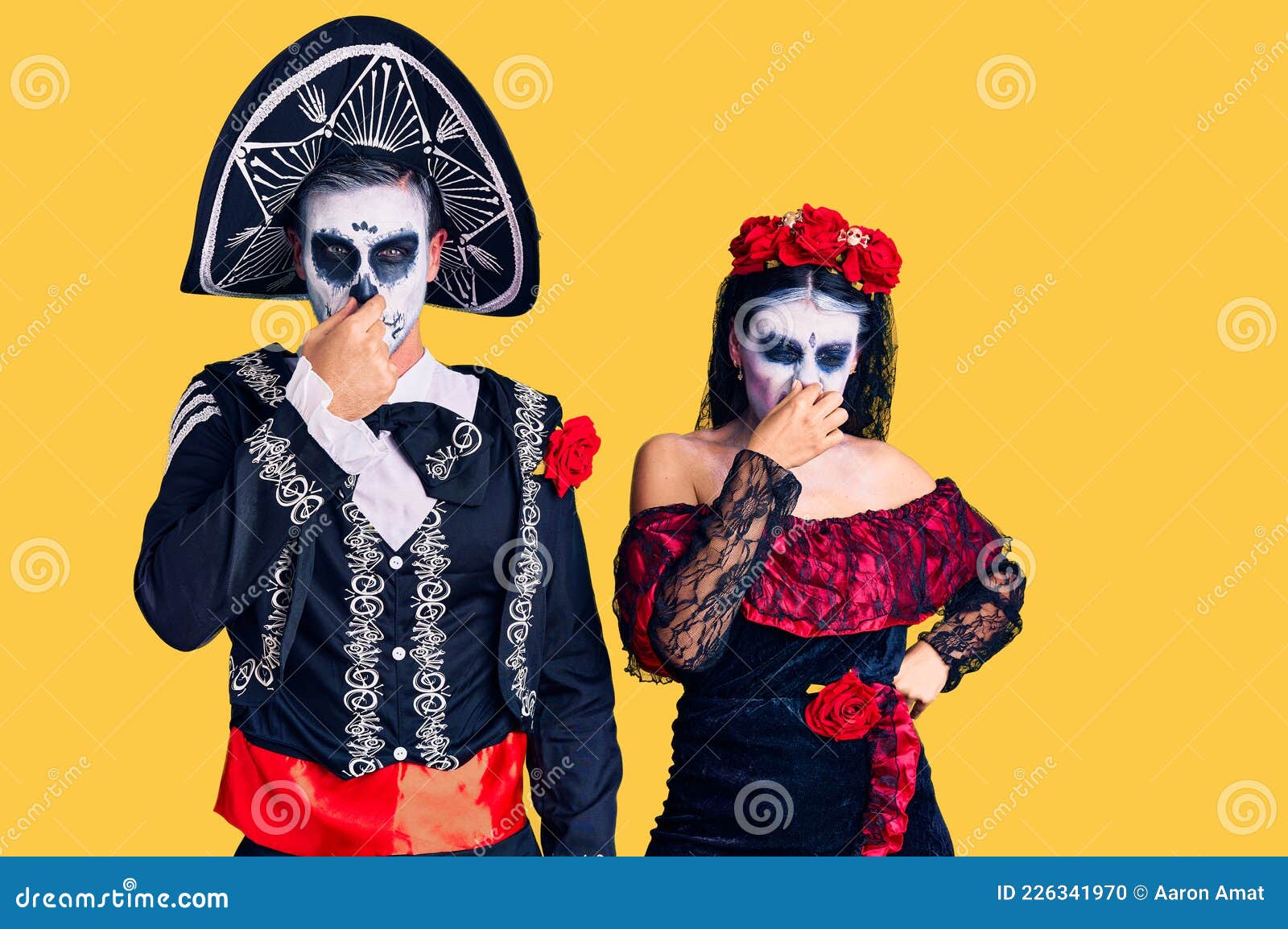Young Couple Wearing Mexican Day of the Dead Costume Over Background ...