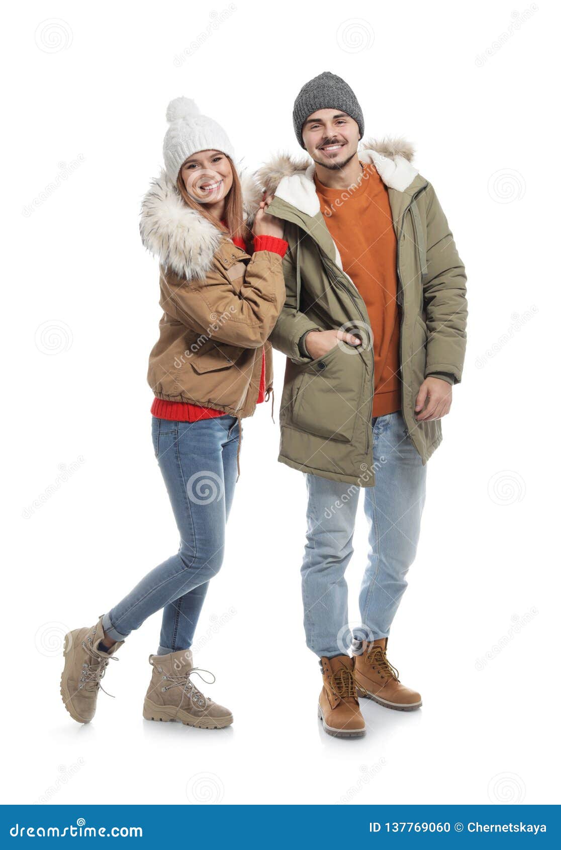 Young Couple Wearing Warm Clothes on White. Ready for Winter Vacation ...