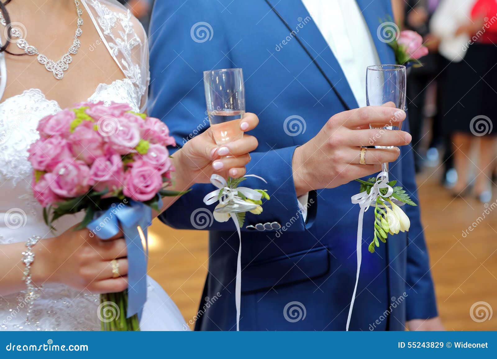 Young Couple at a Wedding Reception with Champagne Glasses Stock Image