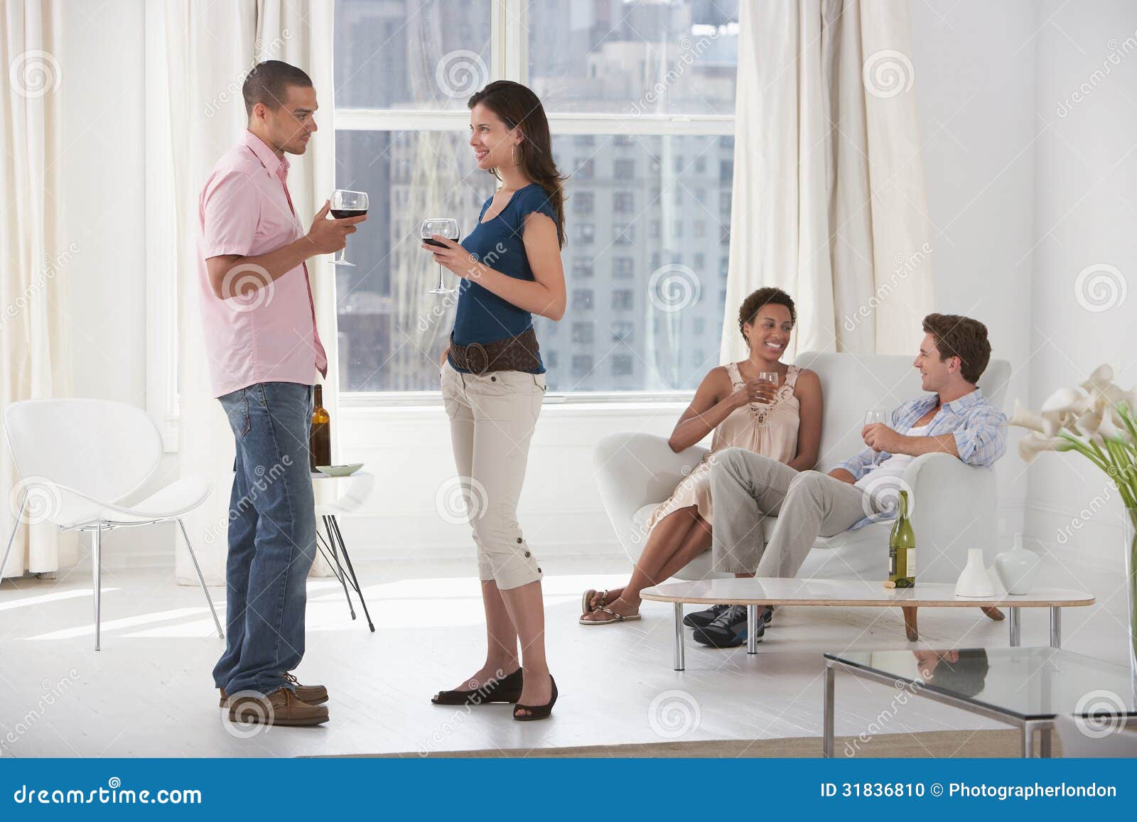 Young Couples Drinking Wine in Living Room Stock Photo Image of