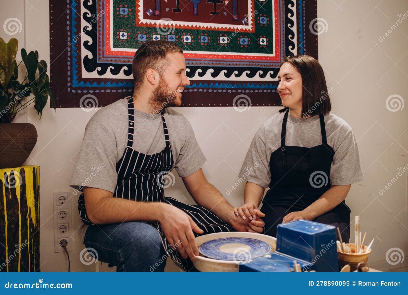Young Couples that Enjoy Making Clay Sculptures. Using Pottery and