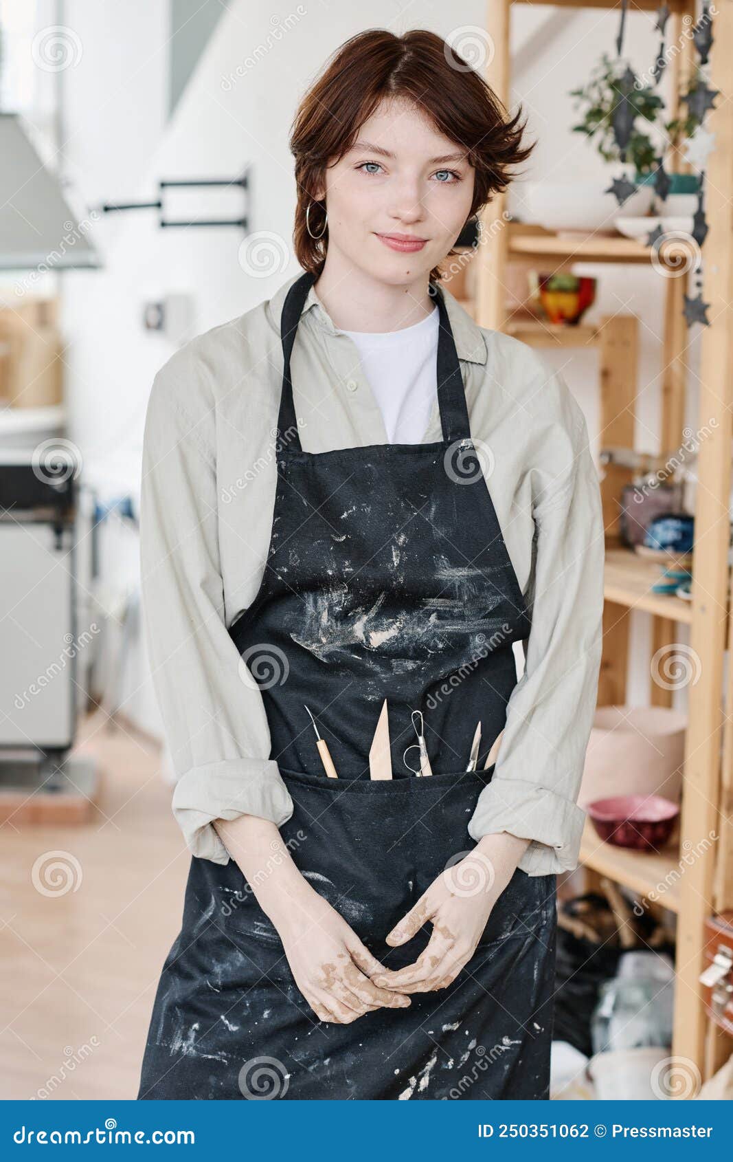 Young Creative Female Pitcher in Workwear Standing in Front of Camera