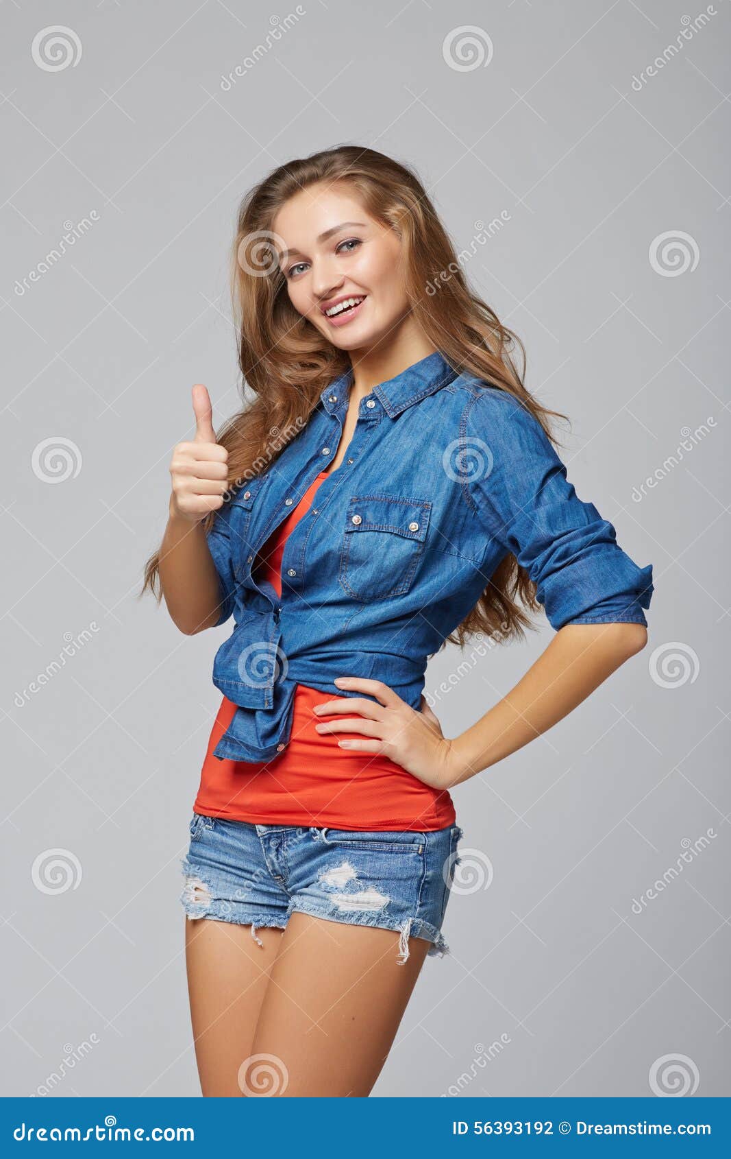 Young Cute Smiling Emotional Girl Giving You Thumb Up, Over Gray Stock ...
