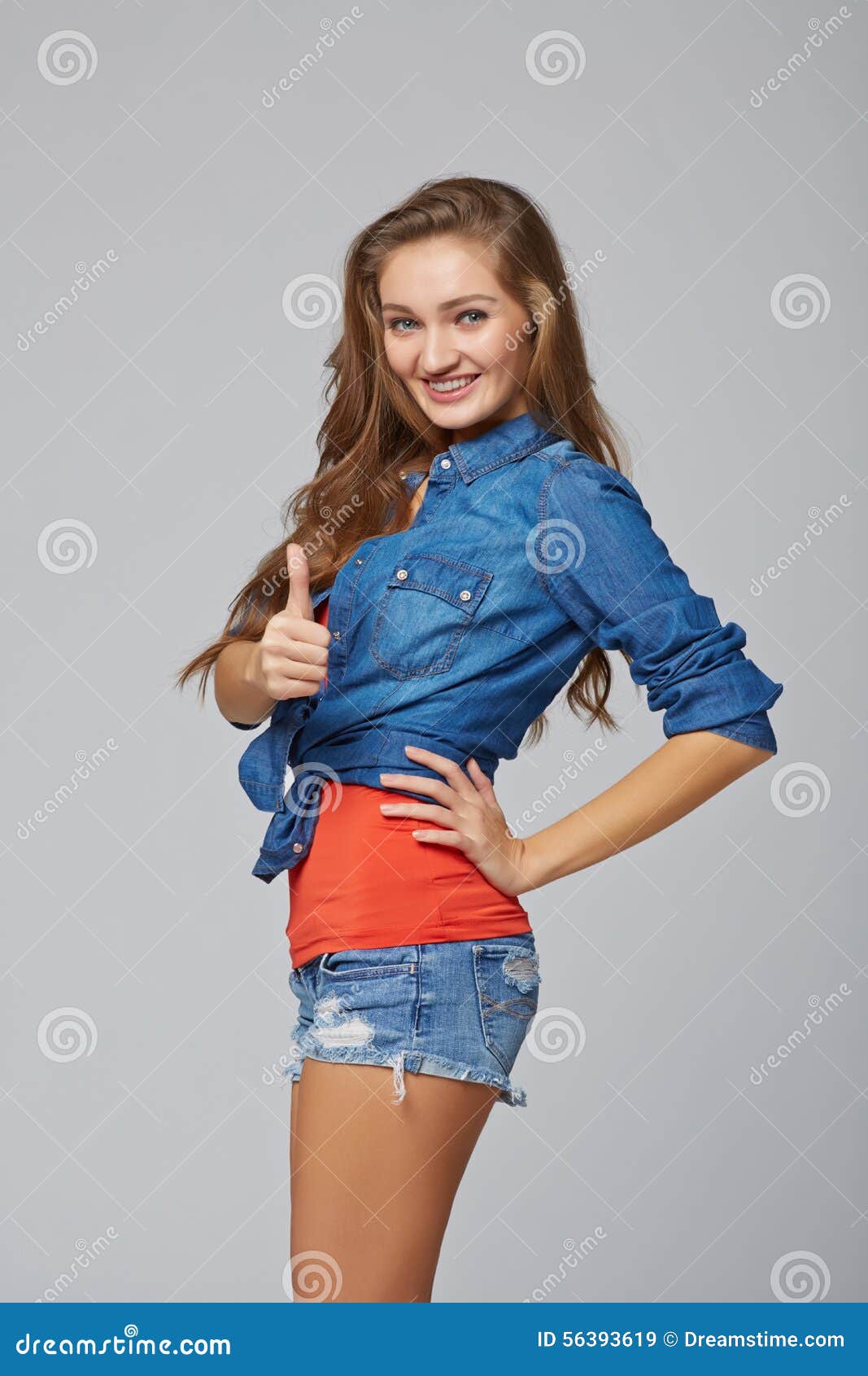 Young Cute Smiling Emotional Girl Giving You Thumb Up, Over Gray Stock ...