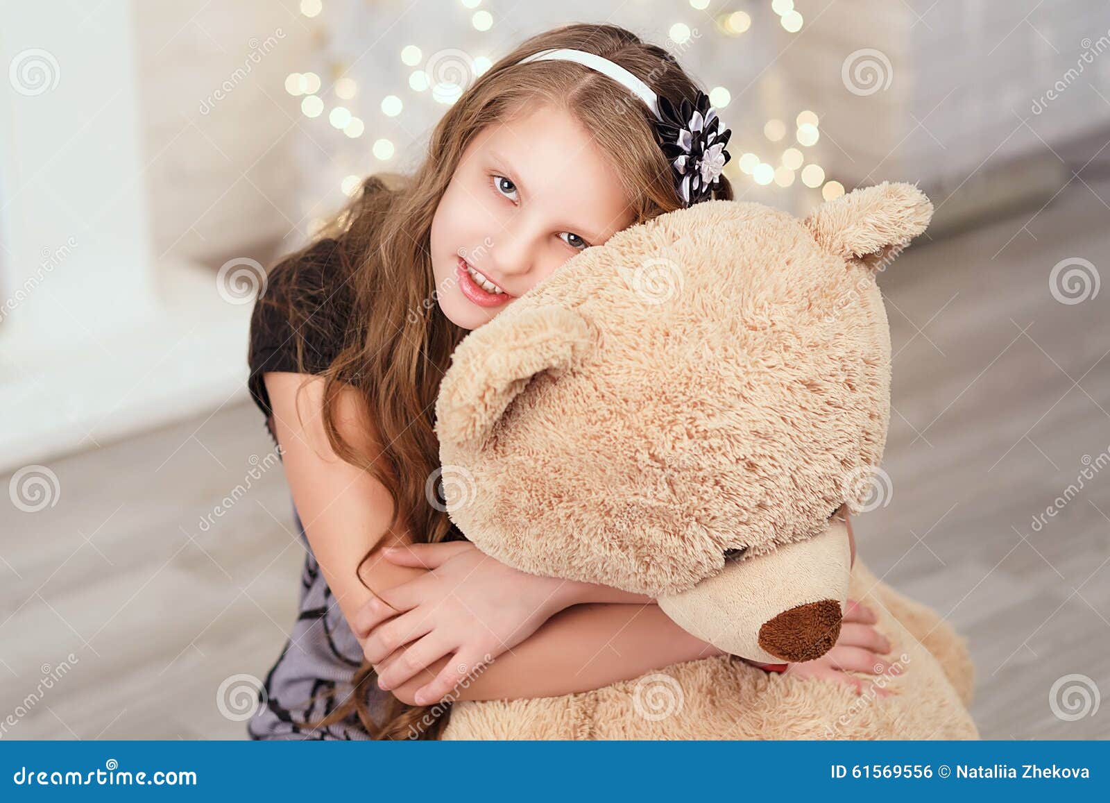 Young Cute Teenage Girl Hugs a Big Soft Teddy Bear in the Interi Stock ...