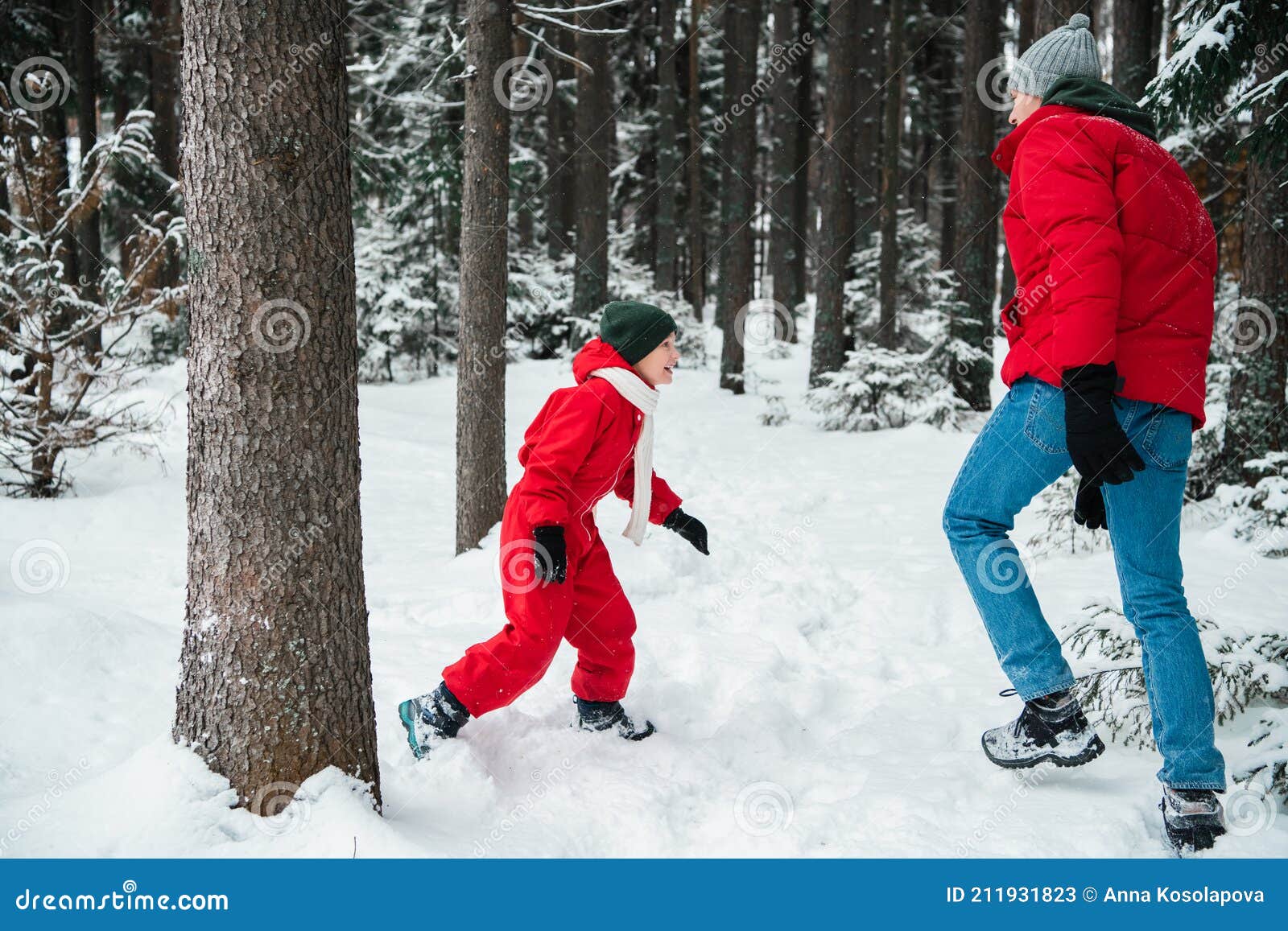 Young Dad Runs with His Son in the Winter Park, Playing and Having Fun ...