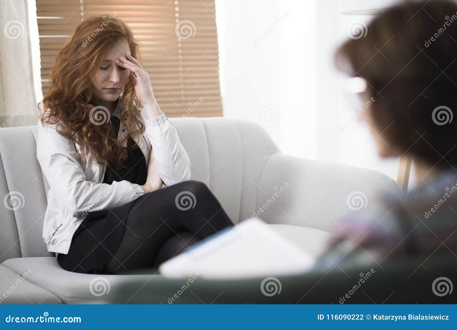 young depressed woman in psychotherapy