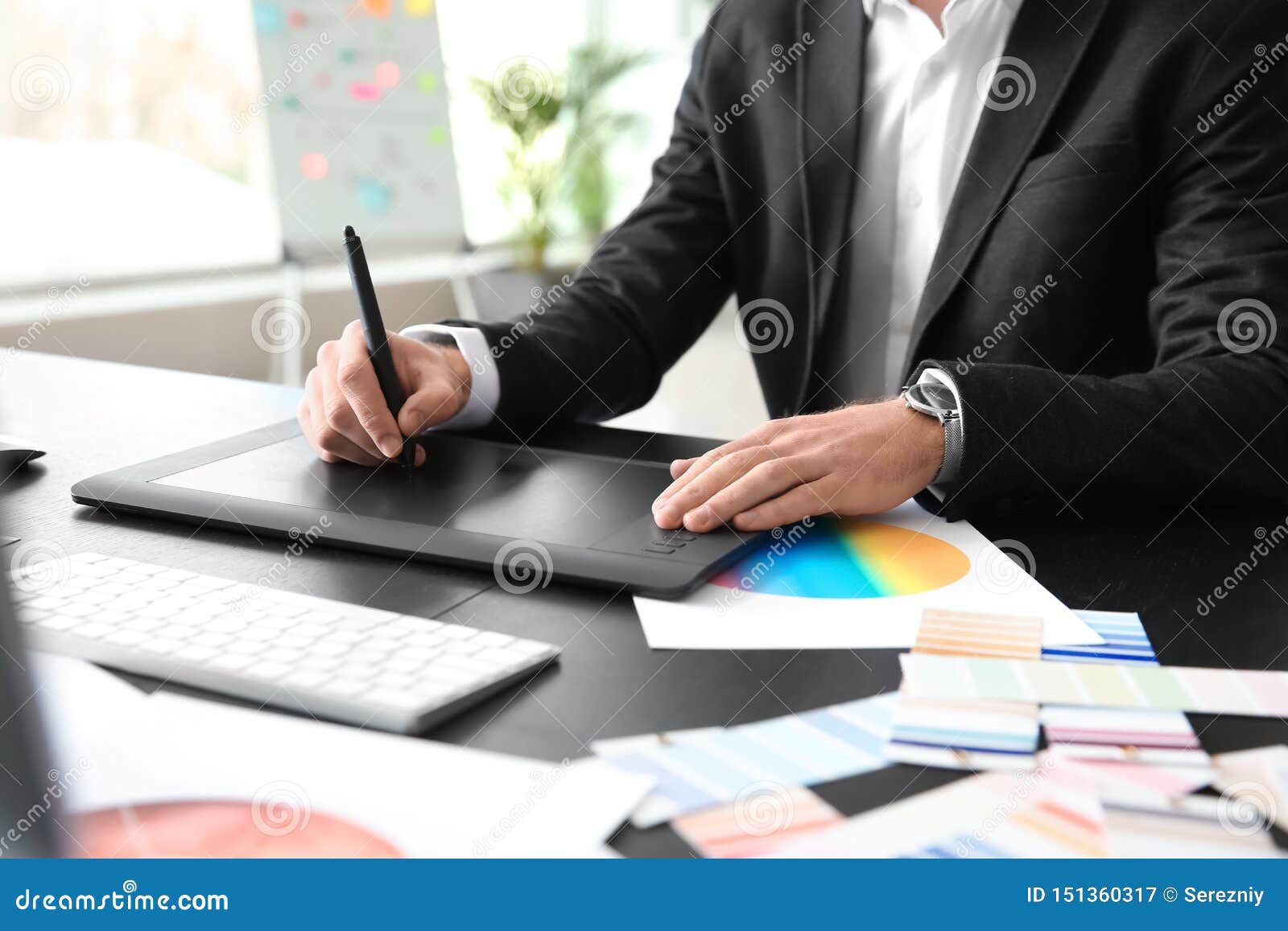 Young Designer with Graphic Tablet Working in Office Stock Image