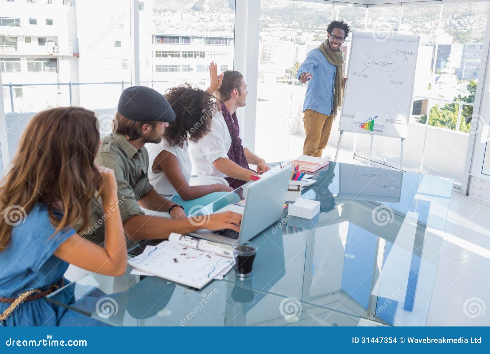 Young Designer Presenting a Flow Chart during a Meeting Stock Photo