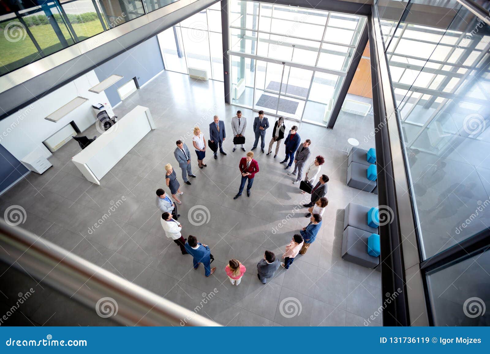 young director hold meeting with his team in circle in company hall