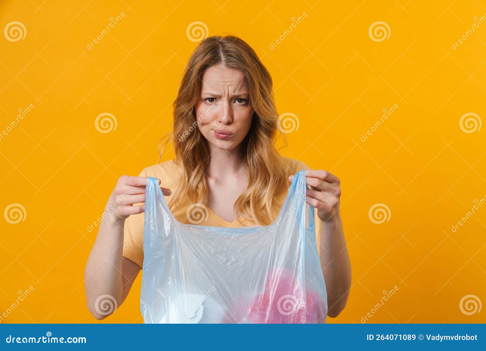 Young Displeased Woman Wearing T-shirt Posing with Trash Bag Stock ...