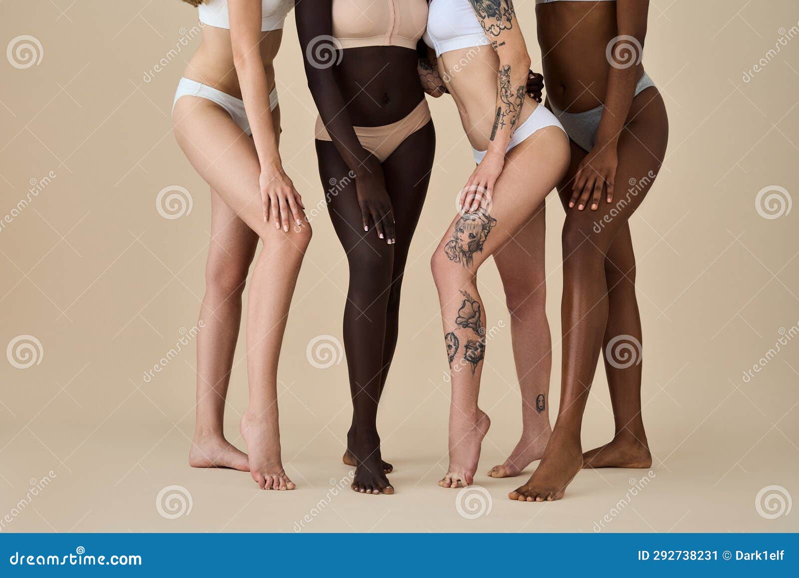 Diverse young women wear underwear sitting showing legs on beige