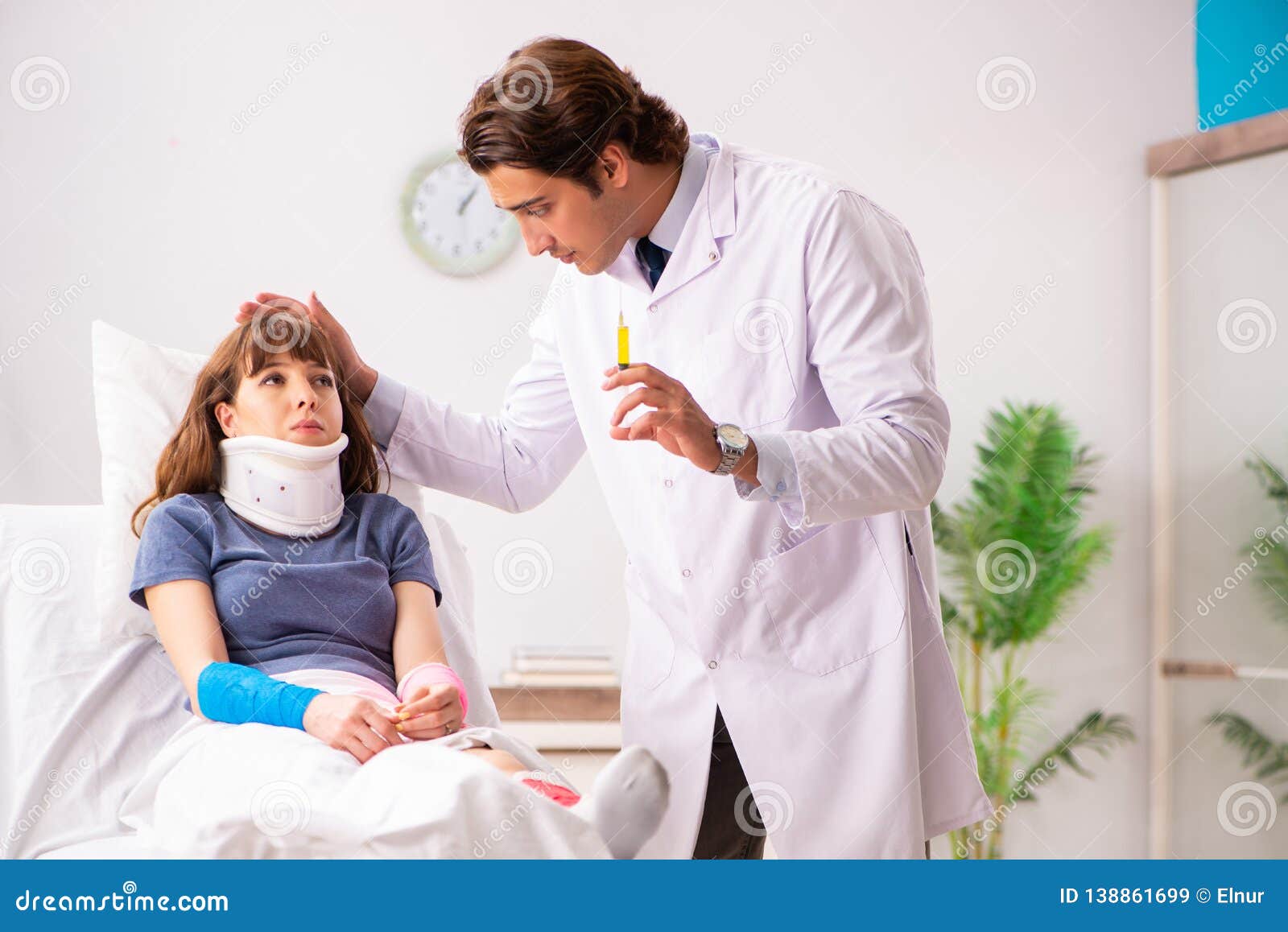 The Young Doctor Examining Injured Patient Stock Image Image of
