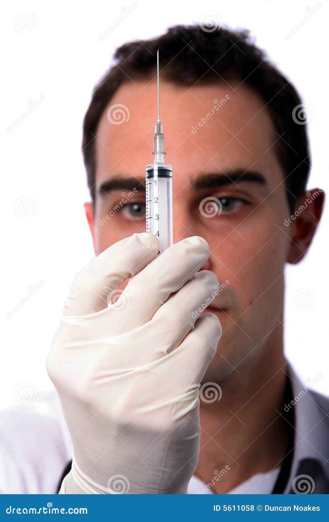 Young Doctor with needle stock photo. Image of practitioner 5611058