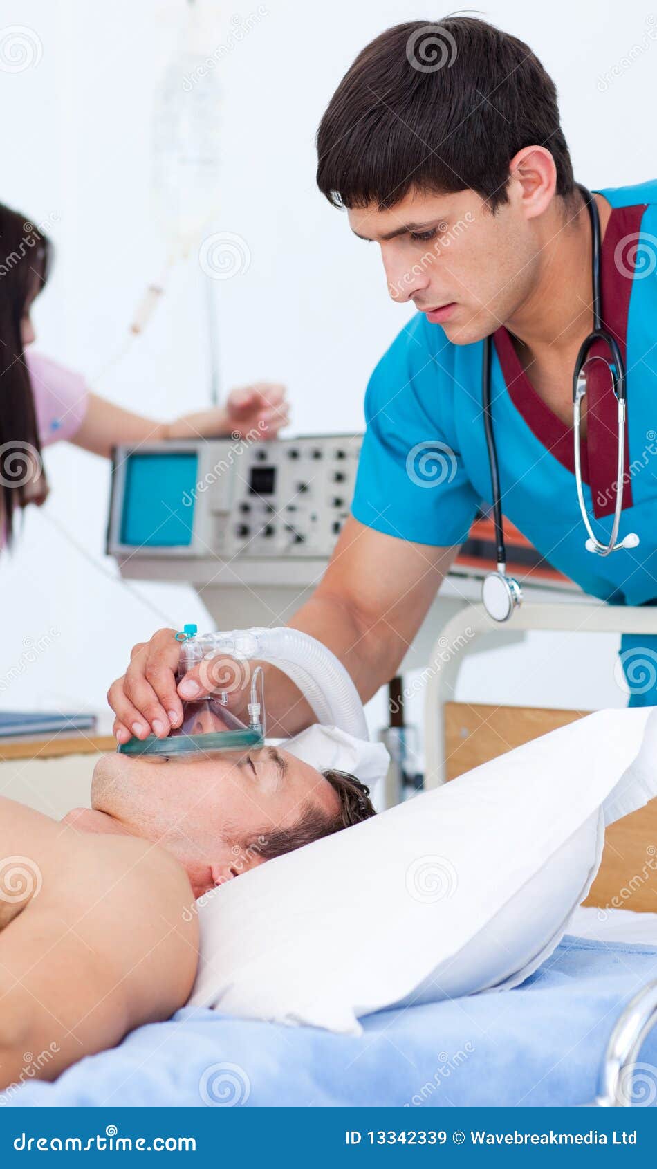 Young Doctor Putting Oxygen Mask on a Patient Stock Image Image of