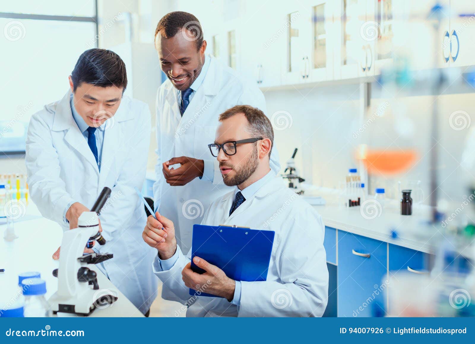 Young Doctors in Uniform Working at Testing Laboratory Stock Photo
