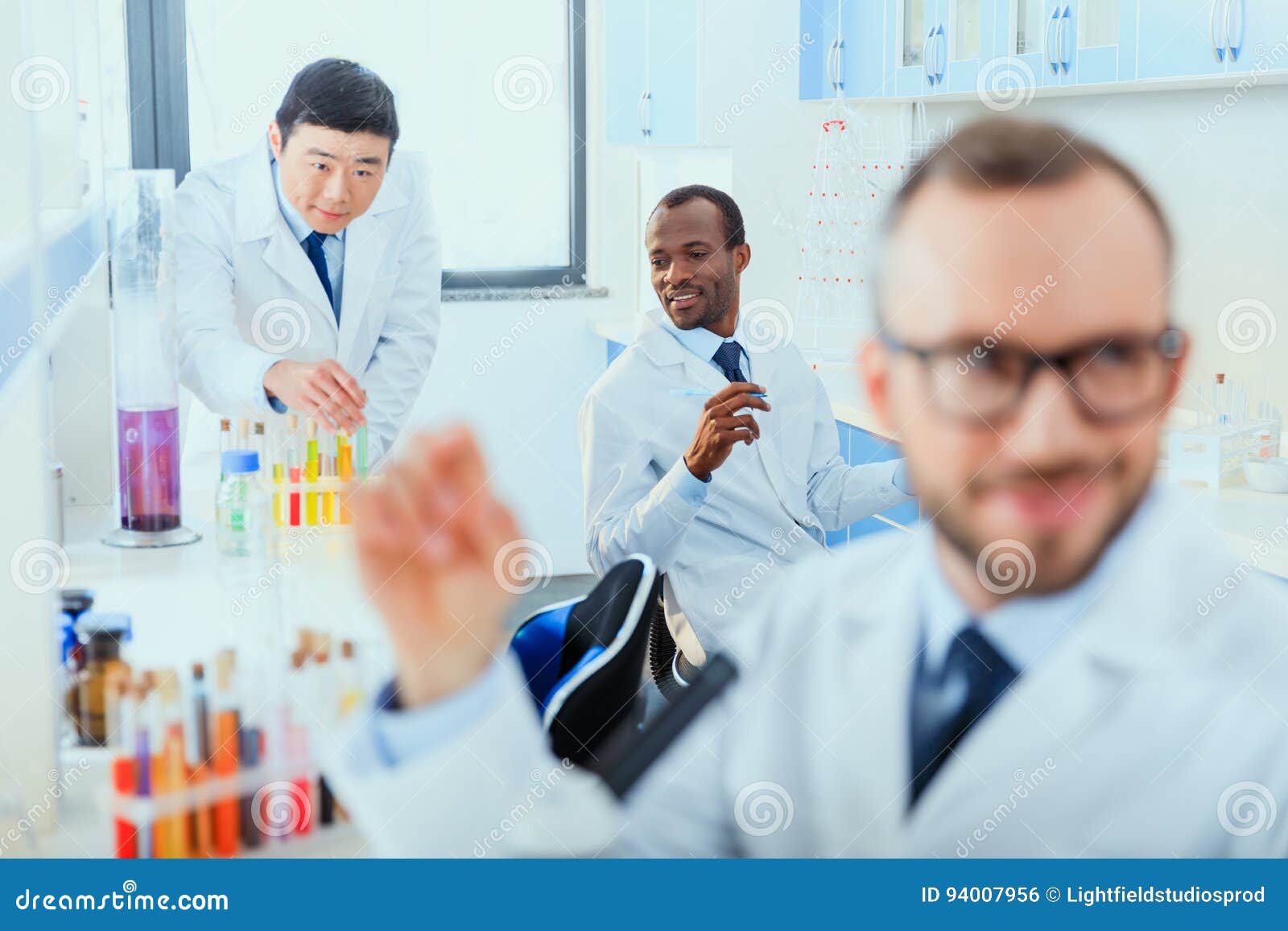 Young Doctors in Uniform Working at Testing Laboratory Stock Photo