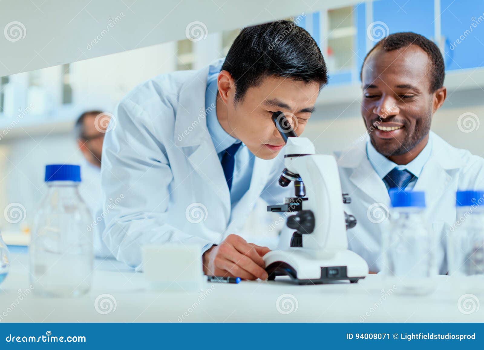 Young Doctors in Uniform Working at Testing Laboratory Stock Image