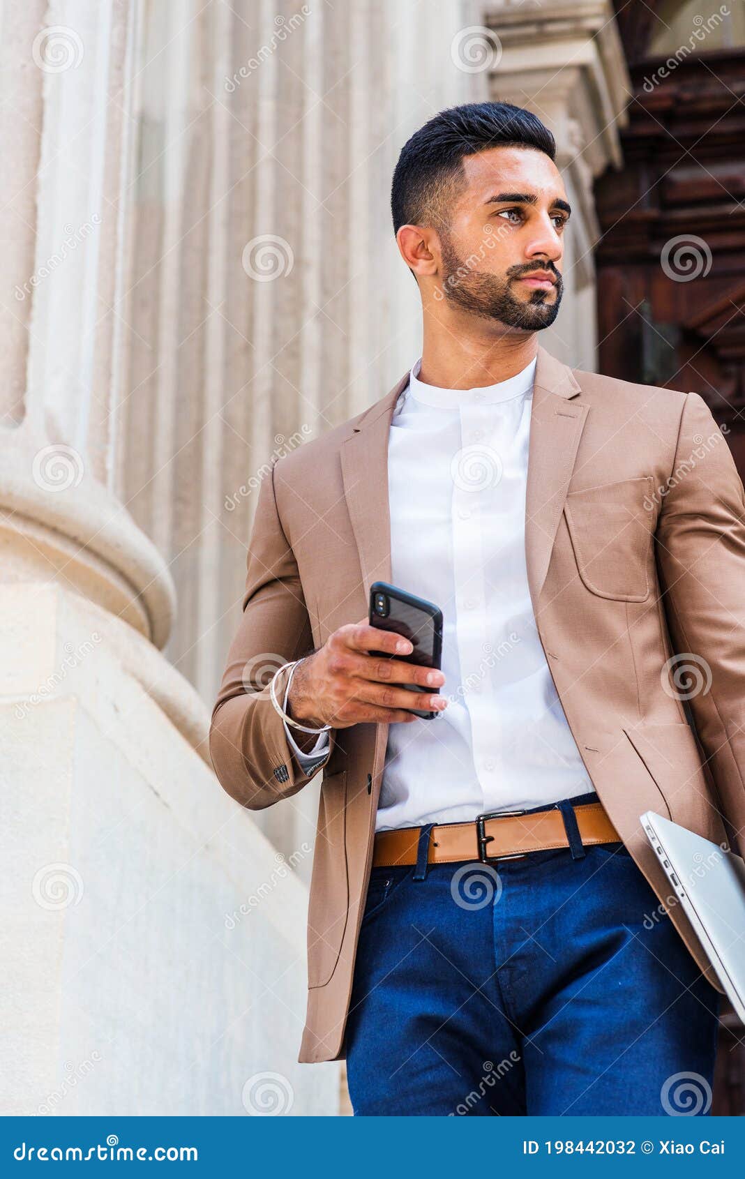 A Man in Brown Jacket and Blue Pants Sitting on the Ground · Free Stock  Photo