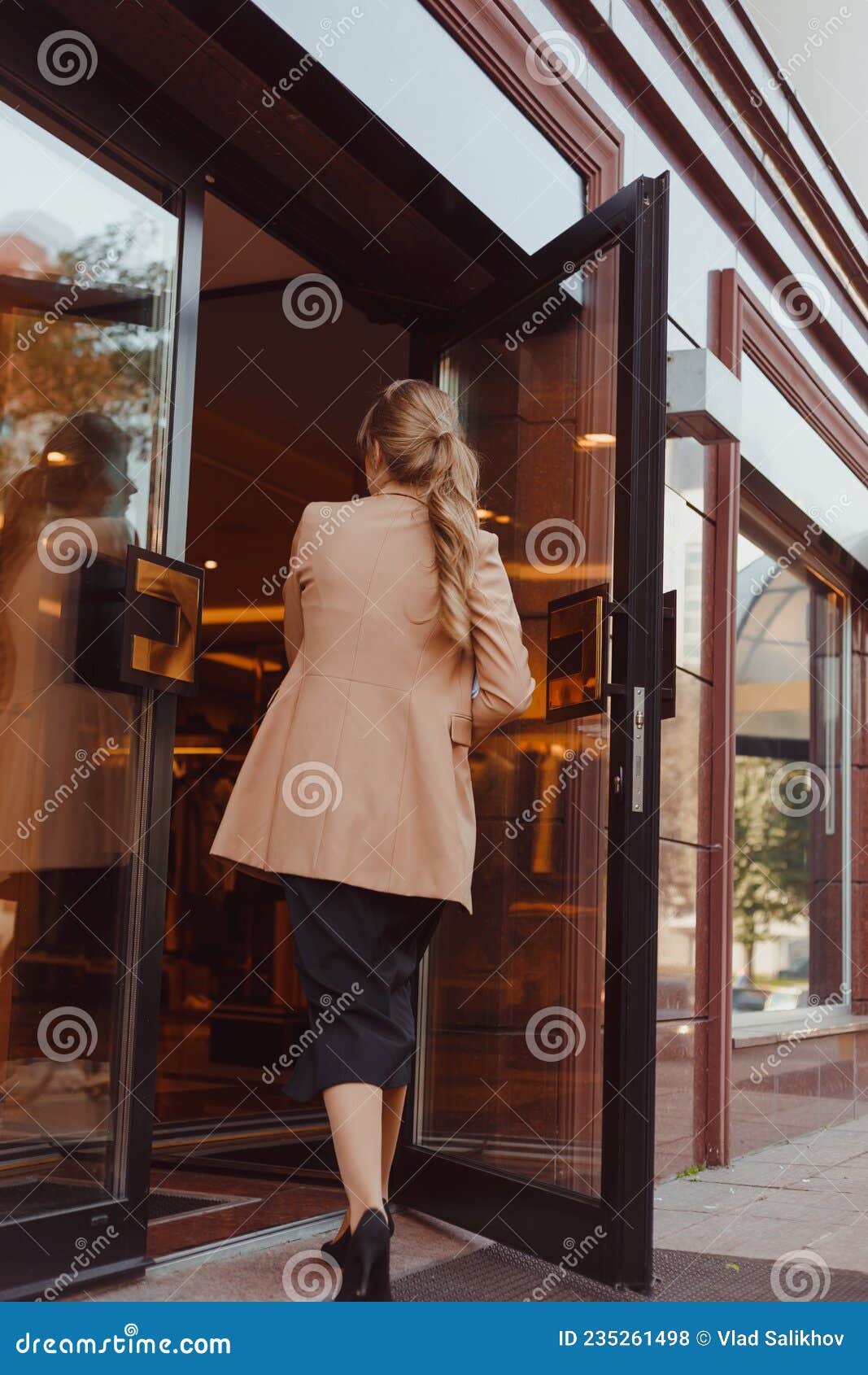 Young Elegant Dressed Woman Entering the Building Stock Photo - Image ...