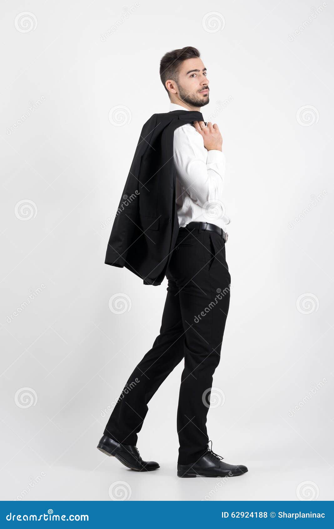 Young Elegant Luxurious Man Walking Carrying Tuxedo Over His Shoulder ...