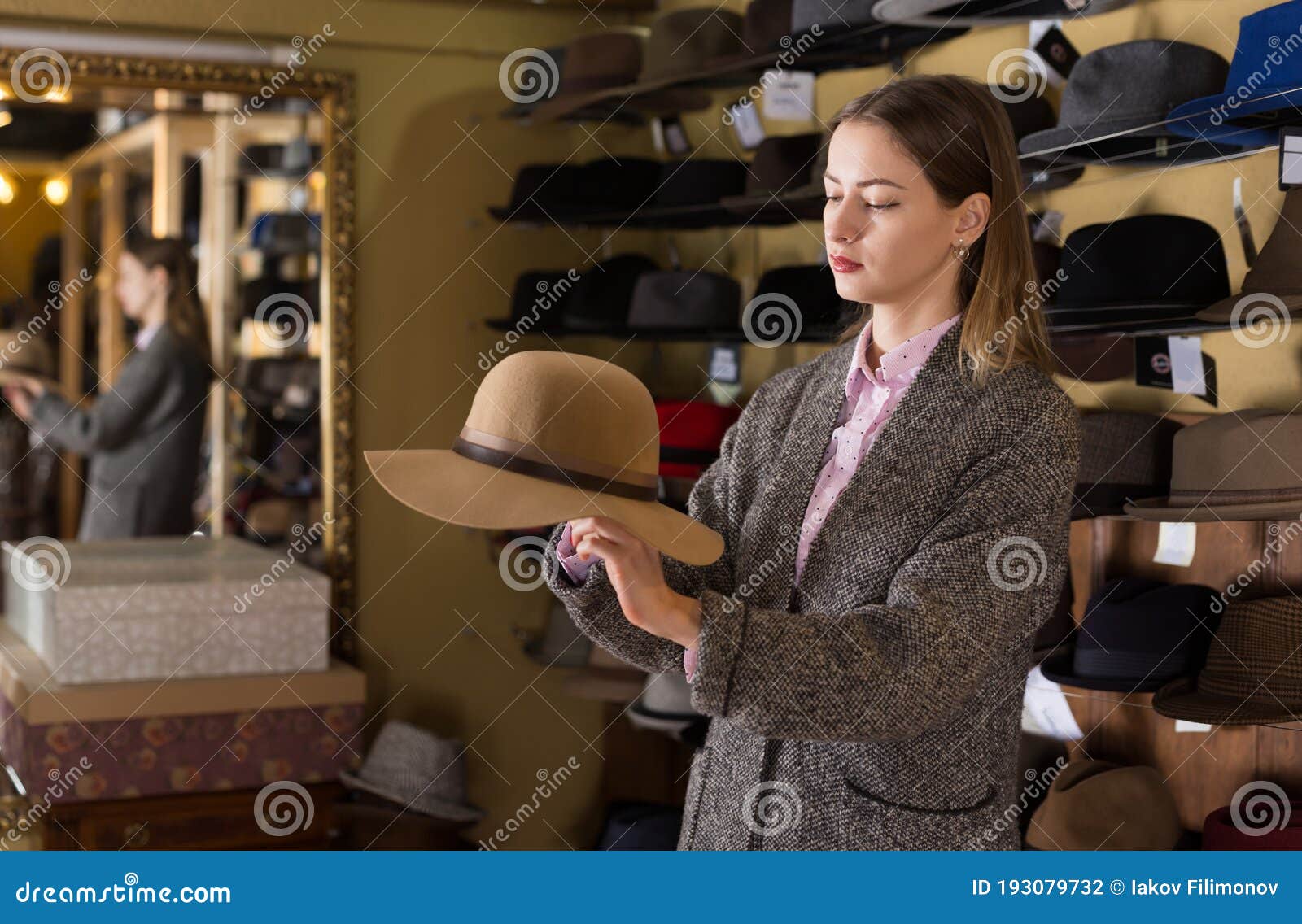 Woman Choosing Hat in Store Stock Photo - Image of consumer, interior ...