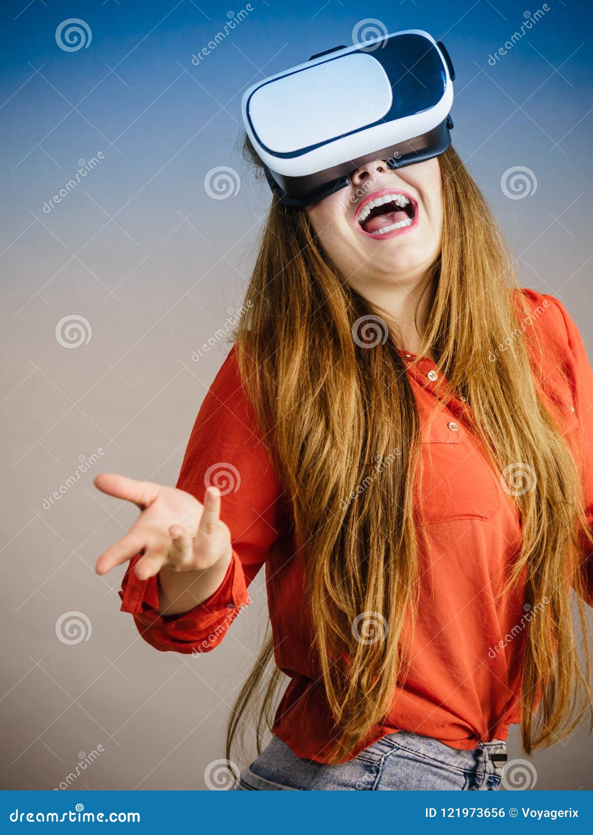 Happy girl wearing virtual reality glasses. Young woman 