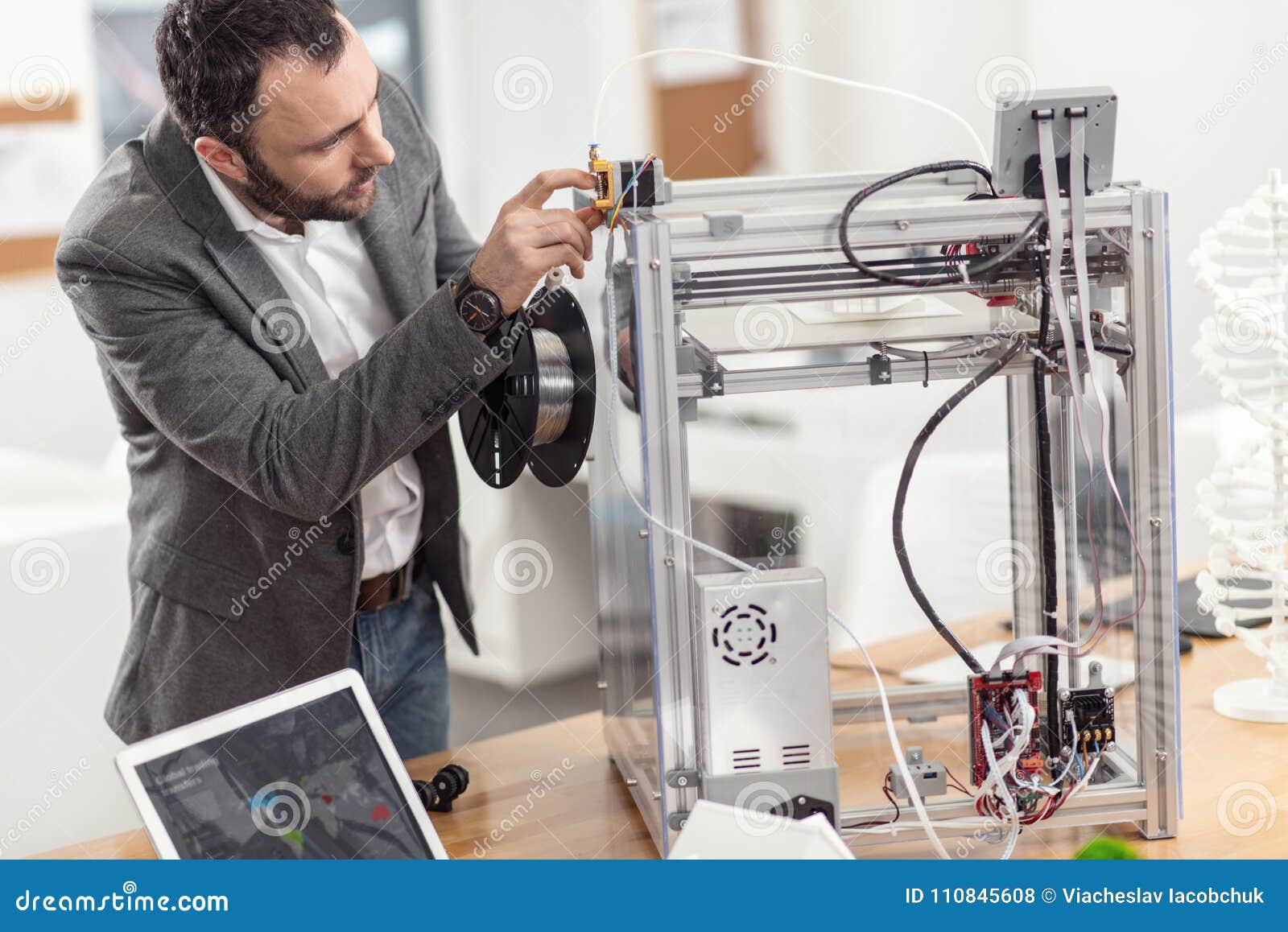 Young Engineer Inserting Filament before Printing Stock Photo Image