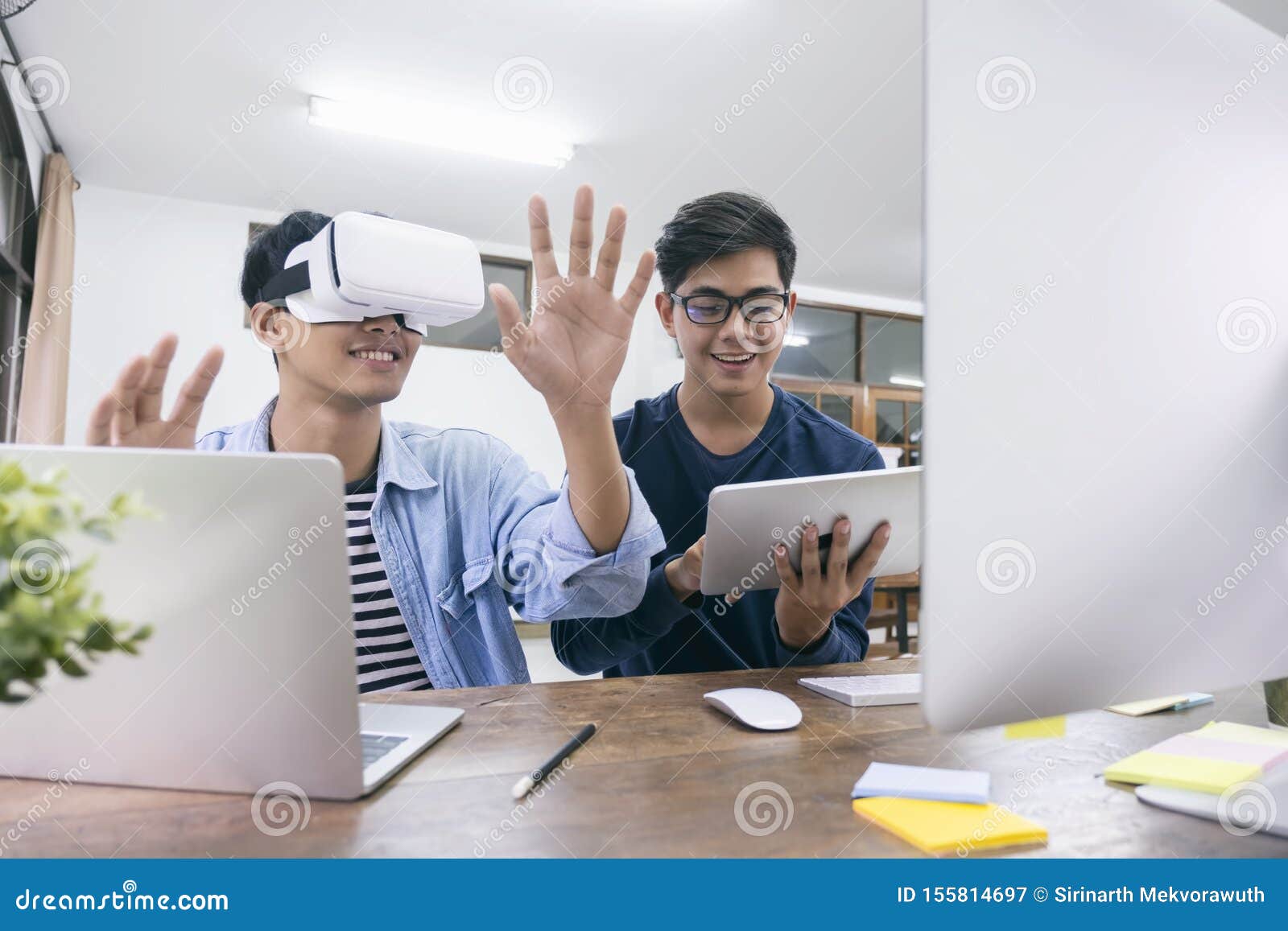 It Engineer and Programmer Testing Software and Working with VR Headset