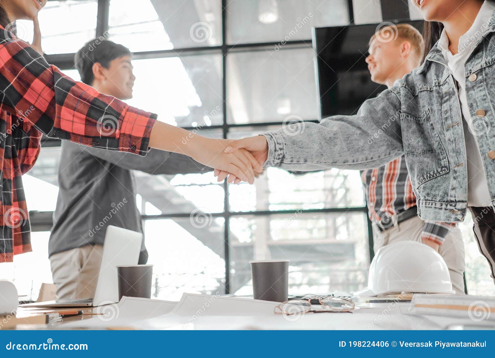 Young Engineers Partners Shaking Hands after Complete Agreement