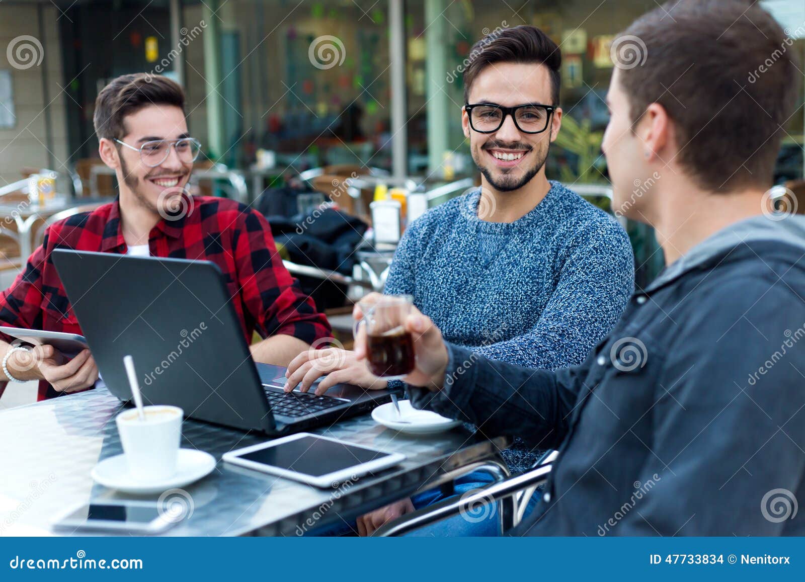 young entrepreneurs working at coffee bar.