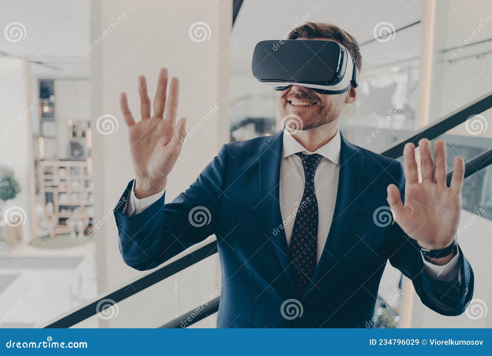 Young Excited Man Office Worker Using Virtual Reality Simulator at Work