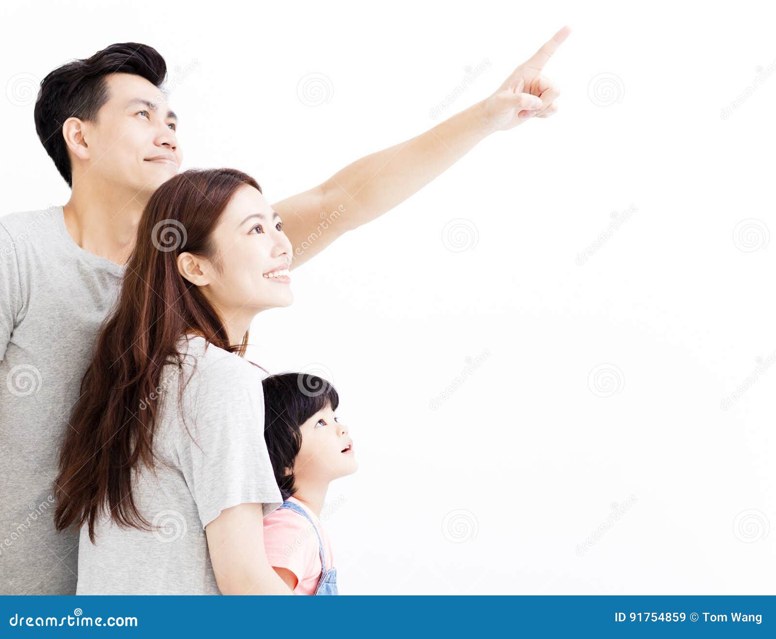 Young Family Pointing and Looking Up Stock Image Image of cute