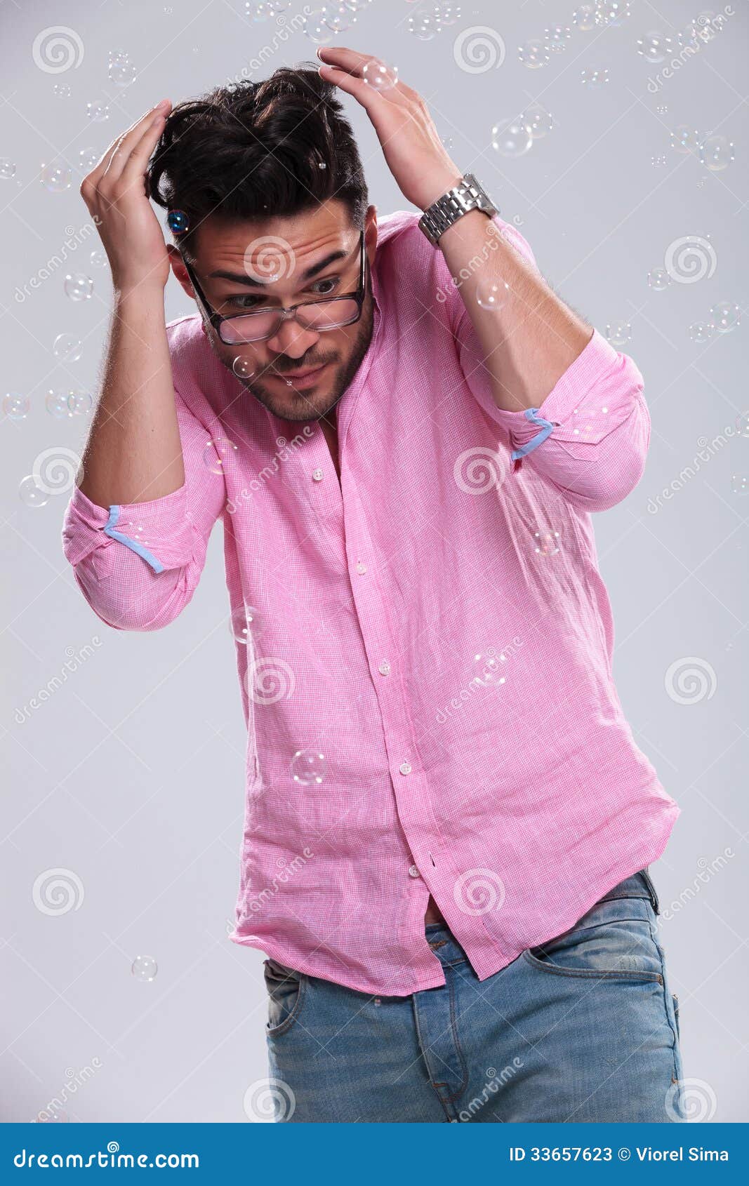 Young Fashion Man Ducking From Bubbles Stock Photos 