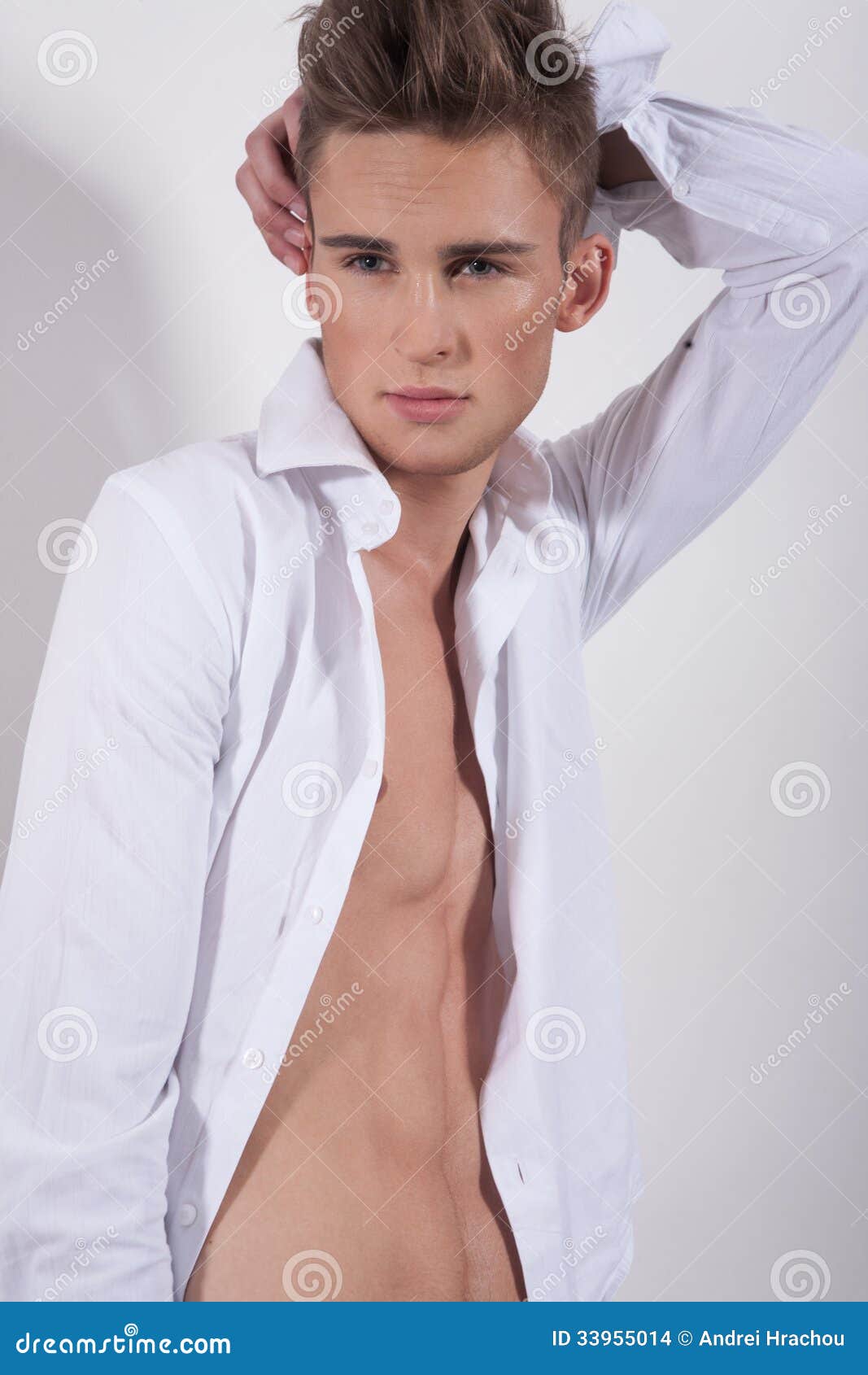 Young Fashion Man With Hand Behind His Head Stock Photo 