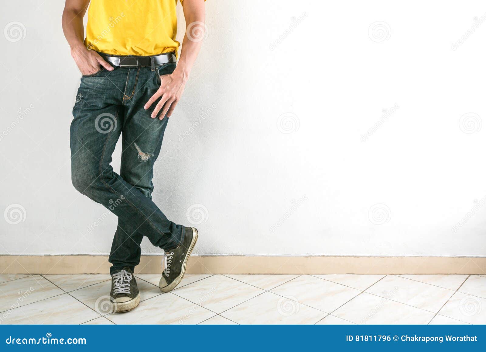 Young Fashion Man`s Legs in Jeans and Shoes on Tile Floor. Stock Photo ...