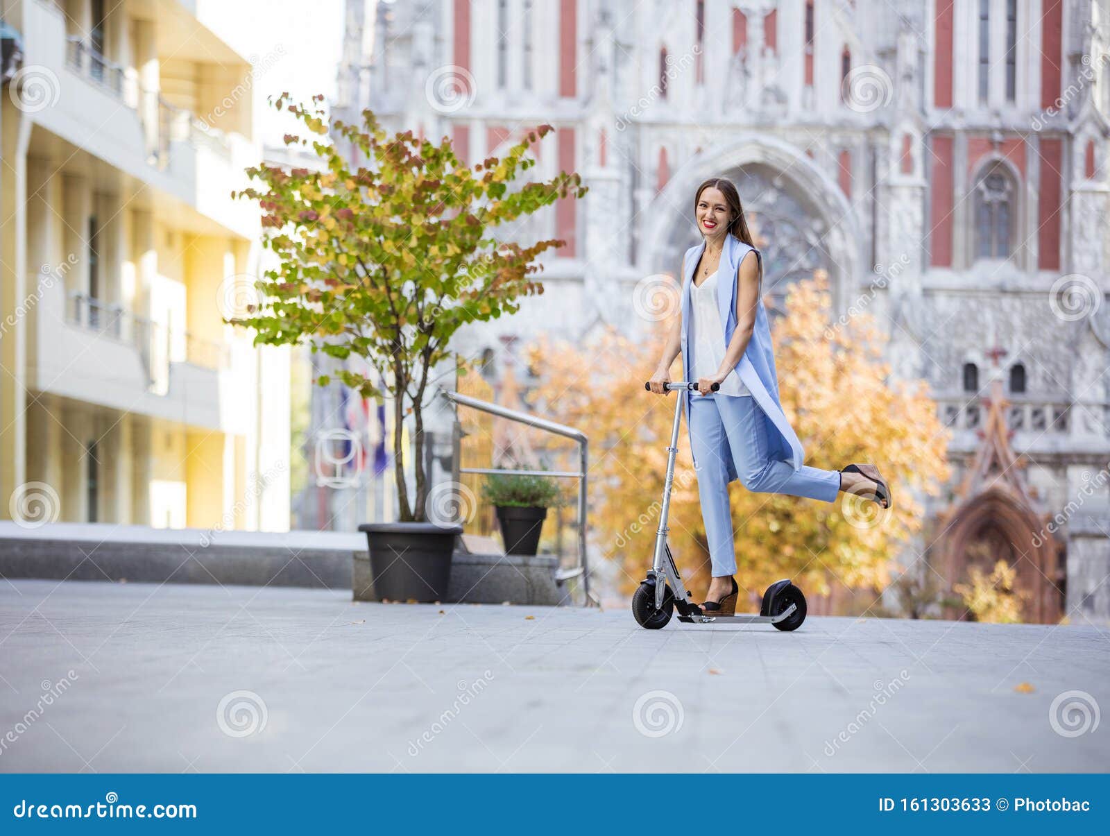 Young Fashion Woman Riding Scooter Downtown on Autumn Day Stock Image ...