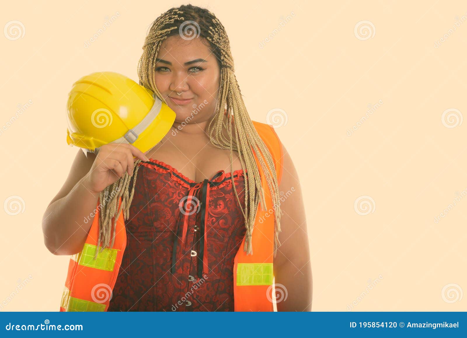 Young Fat Asian Construction Woman Holding Safety Helmet Near The Face