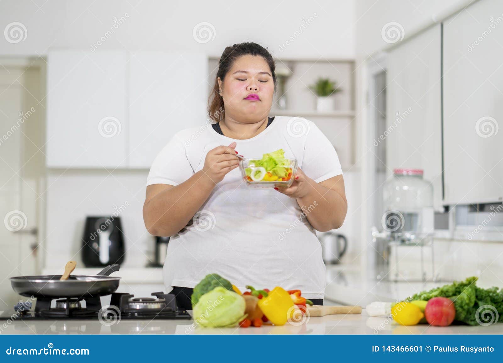 Young Fat Woman Eats Tasty Salad In The Kitchen Stock Image Image Of