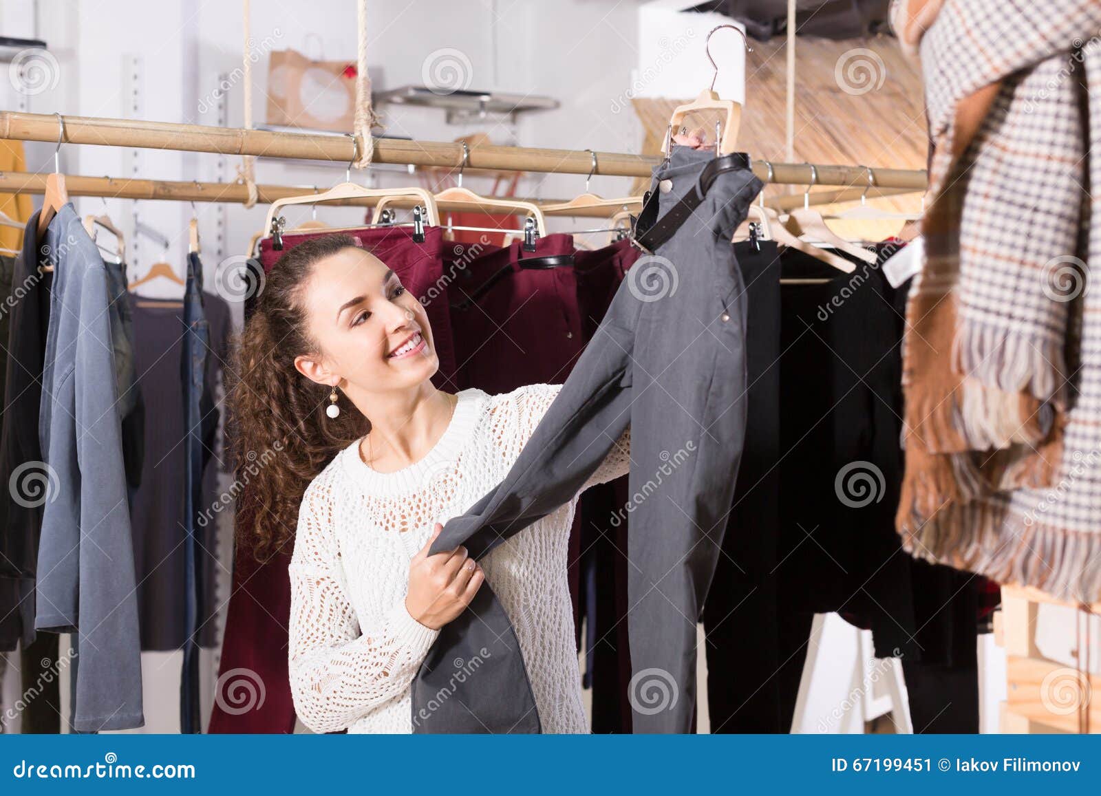 Young Female Brunette Choosing Trousers Stock Image - Image of girl ...