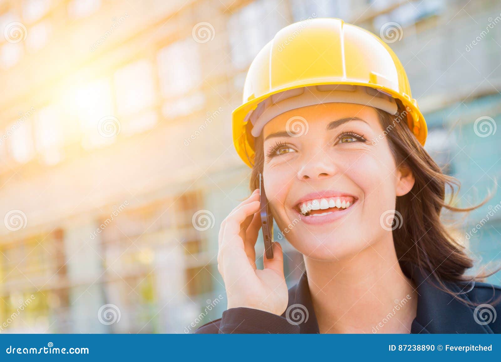 Young Female Contractor Wearing Hard Hat on Site Using Phone Stock Photo Image of outdoors