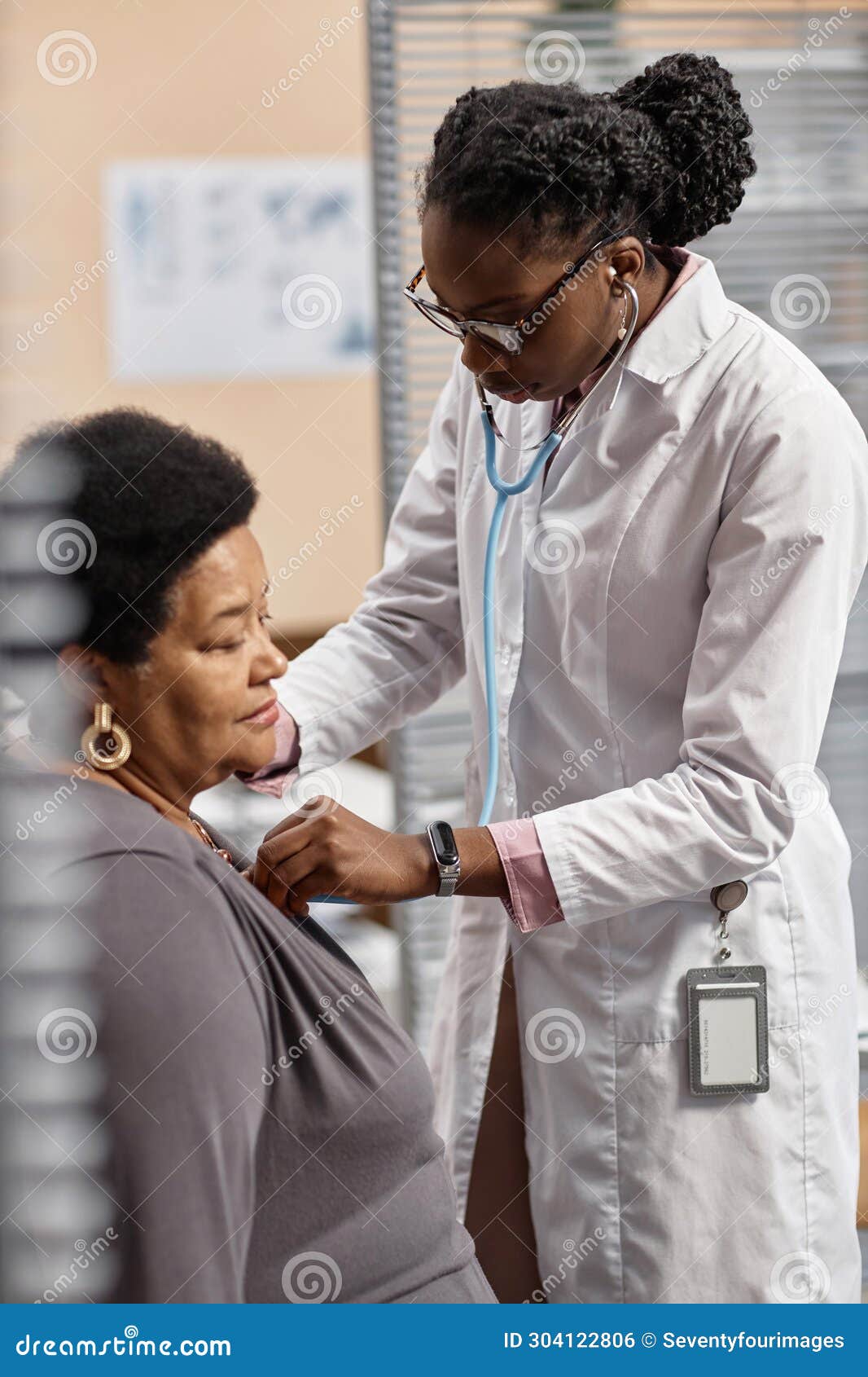young female doctor conducting auscultation