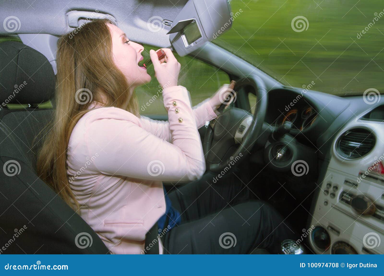 Female Driver Using Lipstick while Driving Stock Photo Image of