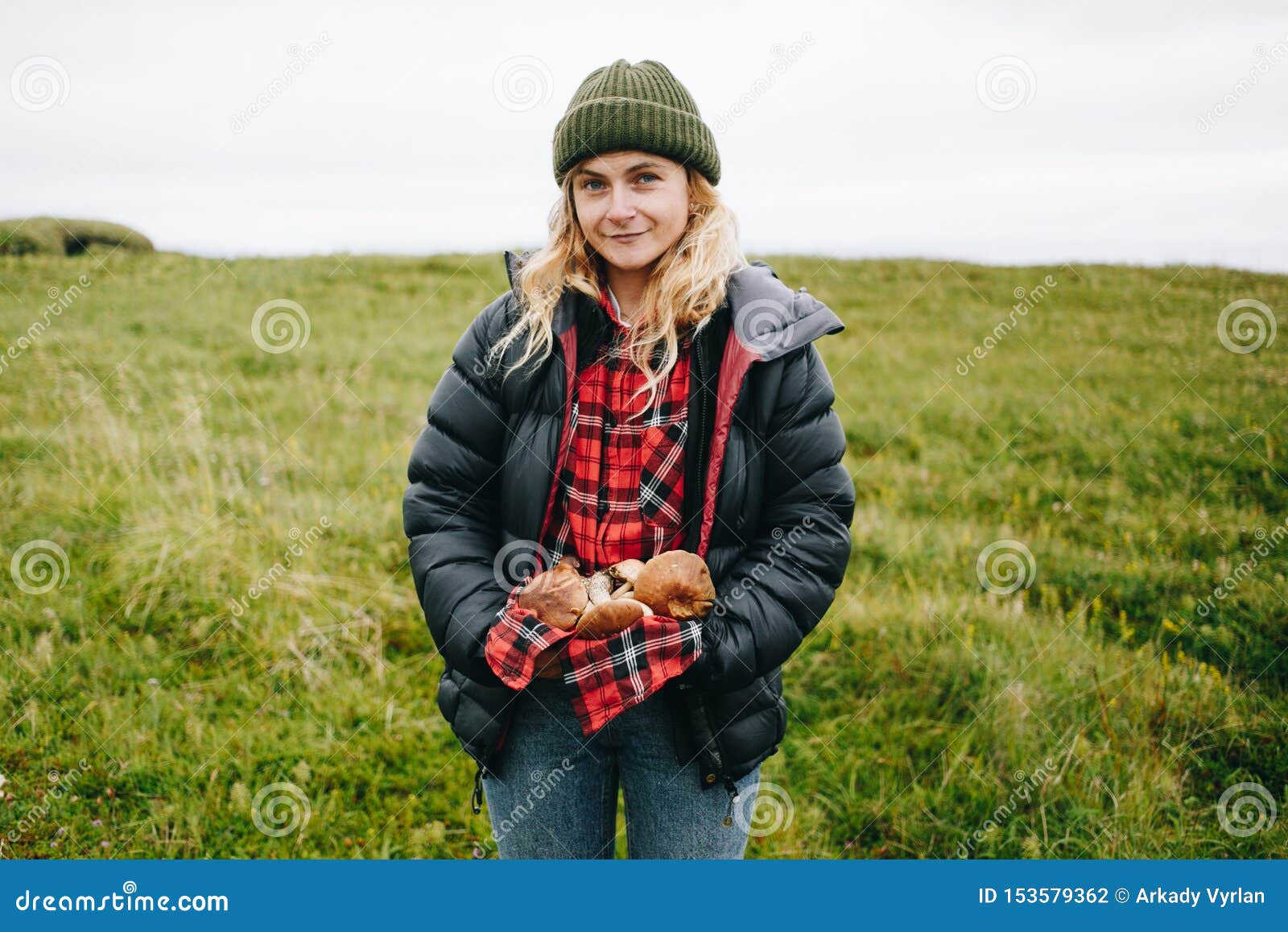 https://thumbs.dreamstime.com/z/young-female-hiking-camping-outfit-puffy-jacket-beanie-hat-holds-arms-pile-wild-fresh-picked-mushrooms-smiles-camera-153579362.jpg