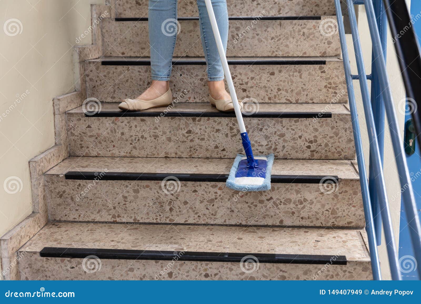 janitor cleaning staircase
