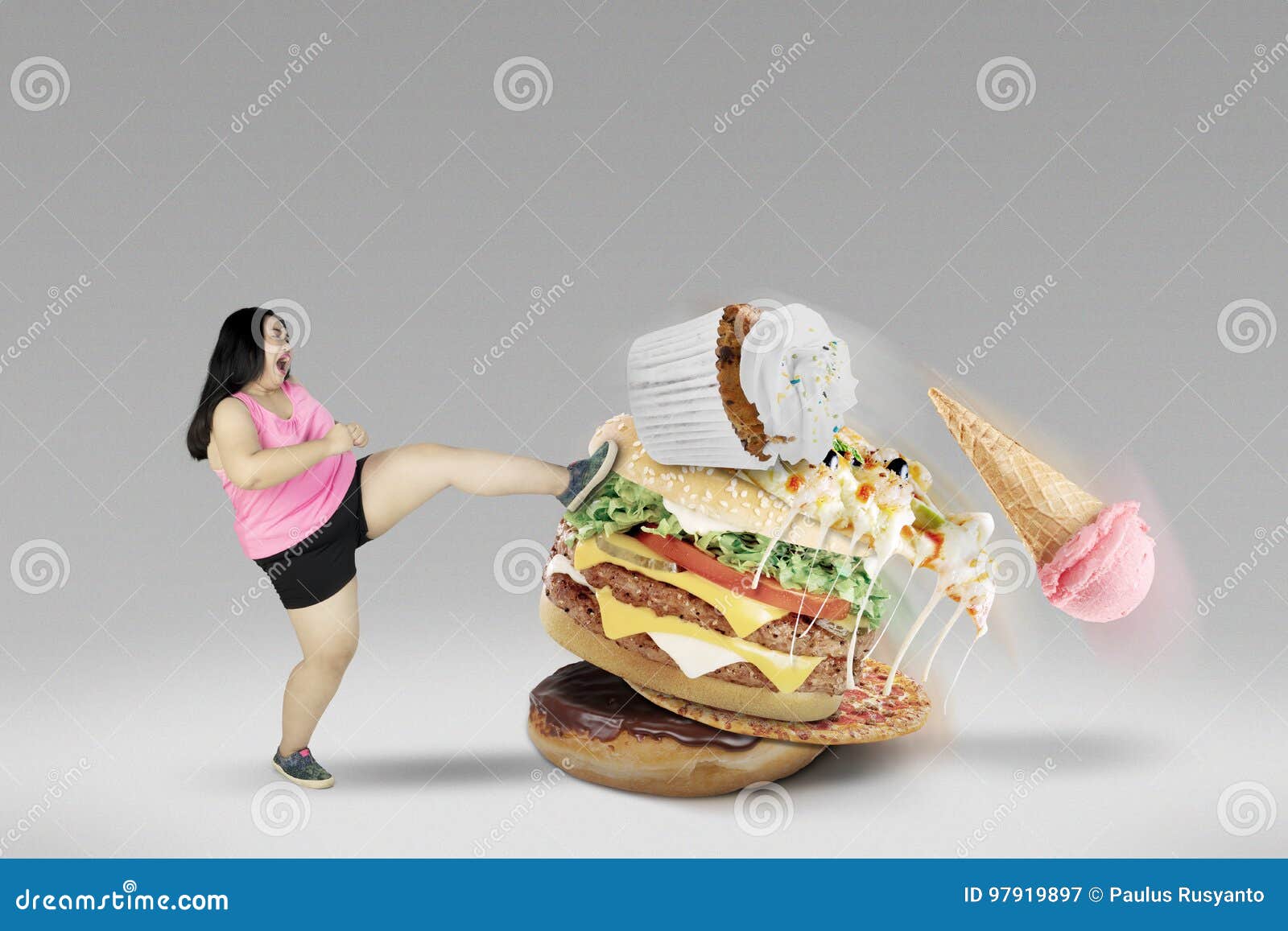 young female kicking unhealthy foods